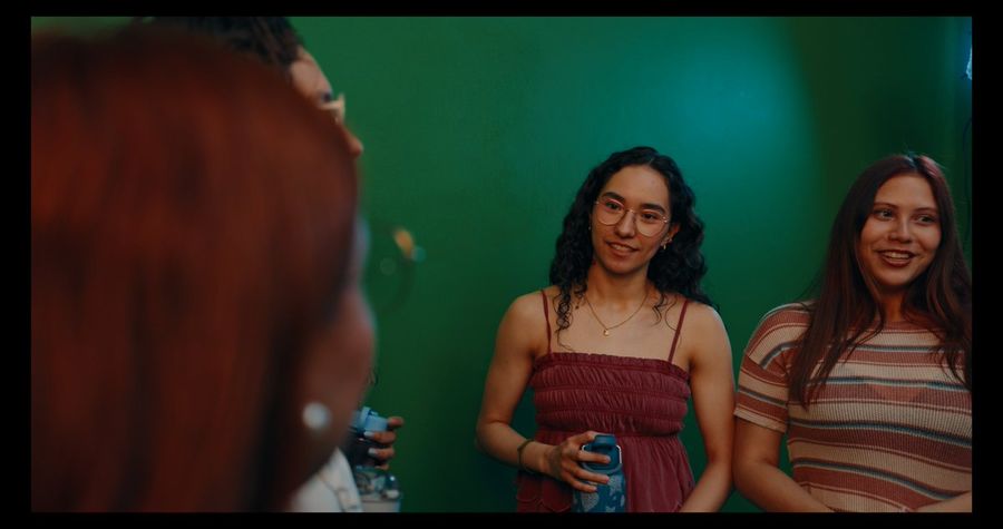 Cinematic Candid Photo of 4 Young Adults Standing in Front — GPT Image 2 image prompt example