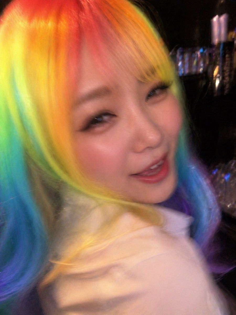 Awkward Blurry Nightclub Rainbow Hair Shot — GPT Image 2 image prompt example