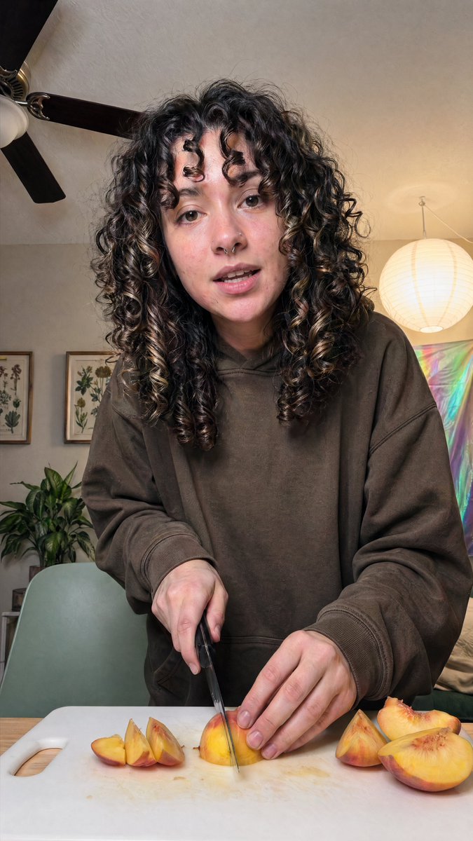 Cozy Indoor Peach Slicing Portrait — GPT Image 2 image prompt example