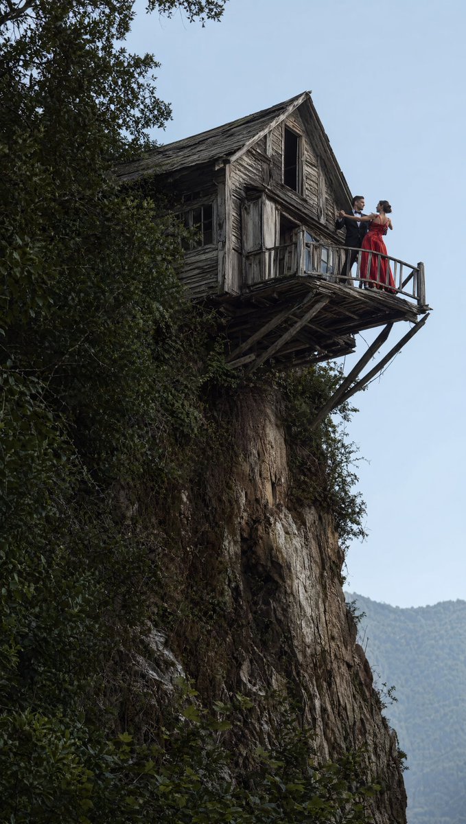 Dancing Couple On Cliffside House — GPT Image 2 image prompt example
