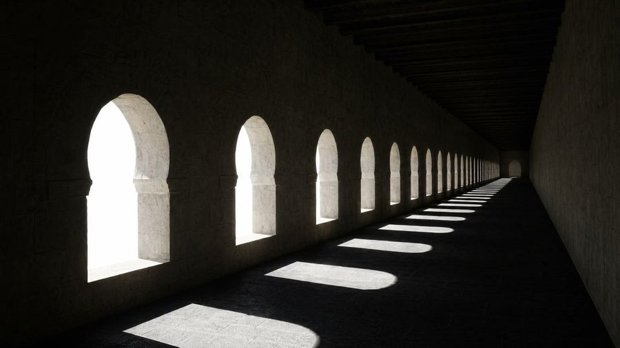Dramatic Stone Corridor With Arched Windows — GPT Image 2 image prompt example
