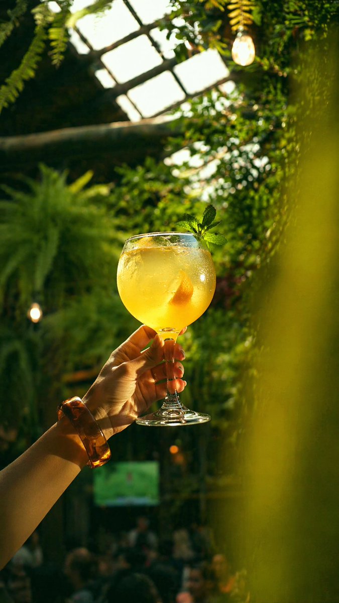 Golden Cocktail In Greenhouse Bar — GPT Image 2 image prompt example