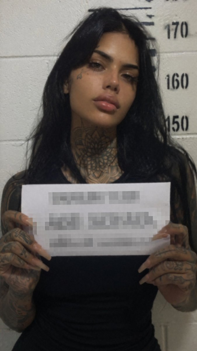 Gritty Tattooed Woman Mugshot — GPT Image 2 image prompt example