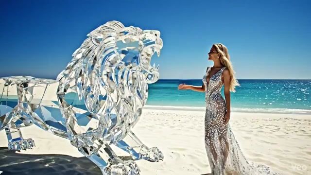Huge Diamond-like Lion, Made of Crystal, Is Roaring on the White — Grok Imagine video prompt example