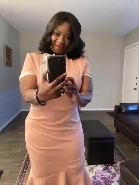 Wearing a Cream and Teal Designer Dress with High Fashion Hat — Grok Imagine video prompt example
