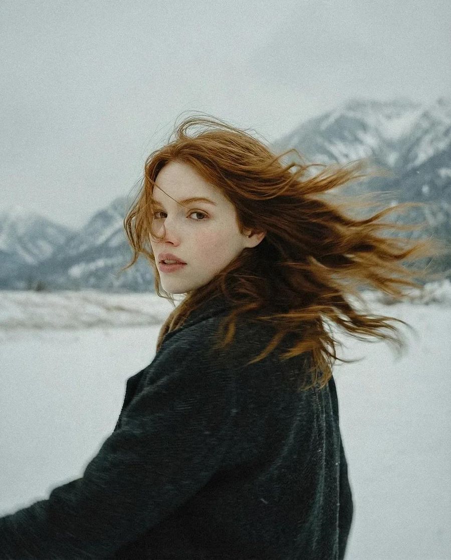 Poetic Cinematic Portrait of a Young Woman Standing Alone in a Vast — Nano Banana Pro image prompt example