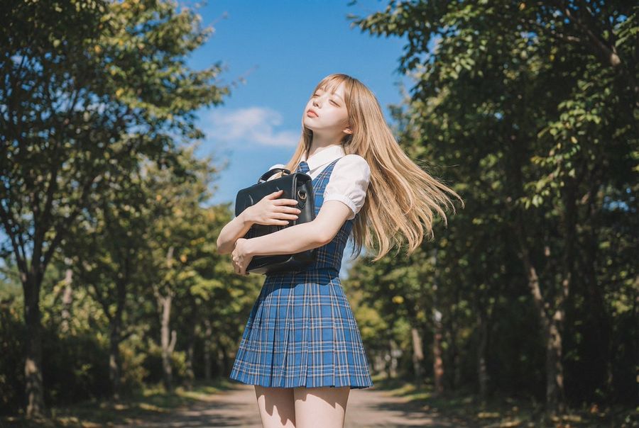Blonde Girl Walking Down A Tree Lined Street Video Prompt — generated with Nano Banana Pro