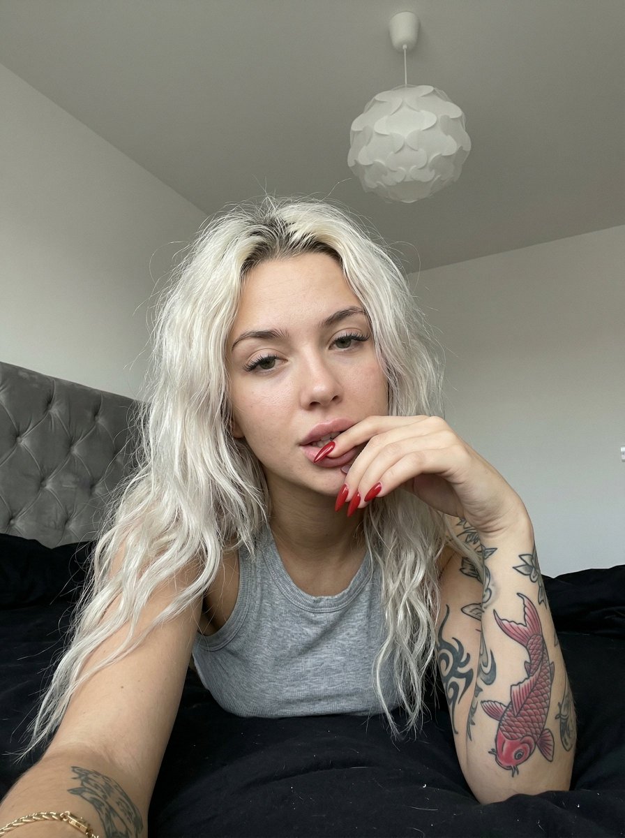 Casual Smartphone Photo Of A Tattooed Woman In A Bedroom — Nano Banana Pro image prompt example