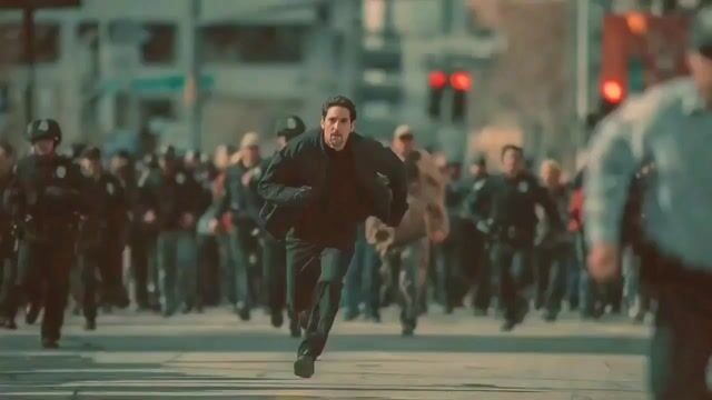 A man in a black jacket, face etched with panic, sprints... — Seedance 2.0 video prompt example